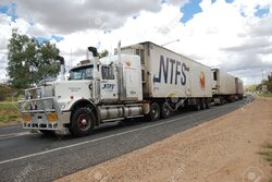 12271408-Road-train-in-Australian-outback-Stock-Photo.jpg